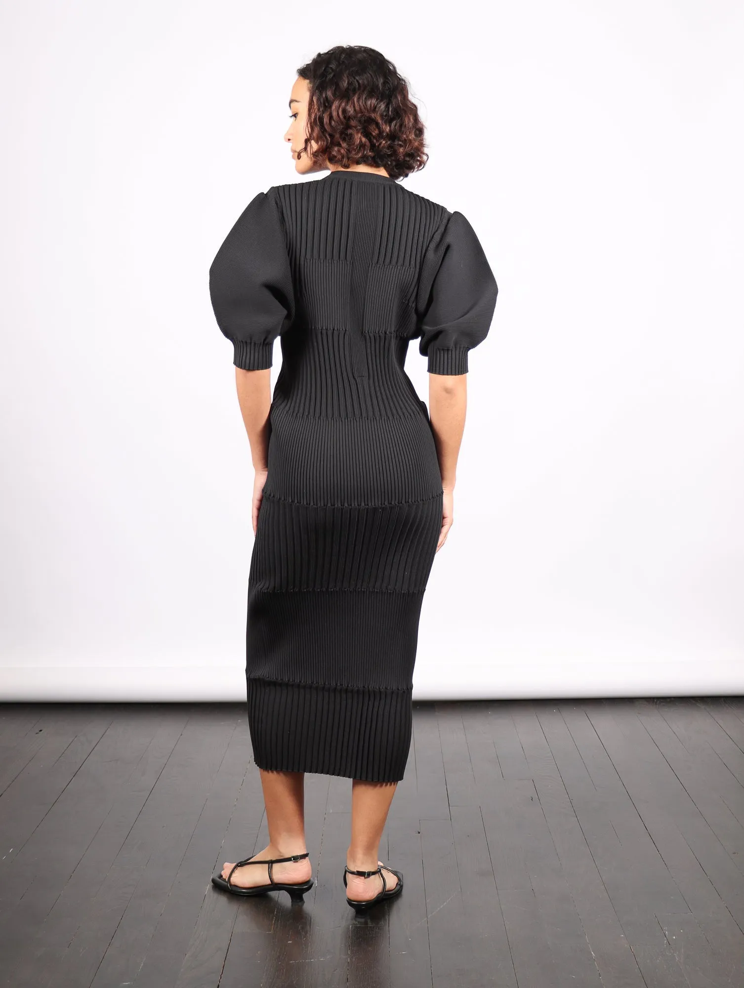 Fluted Short Puff Sleeve Dress in Black by CFCL