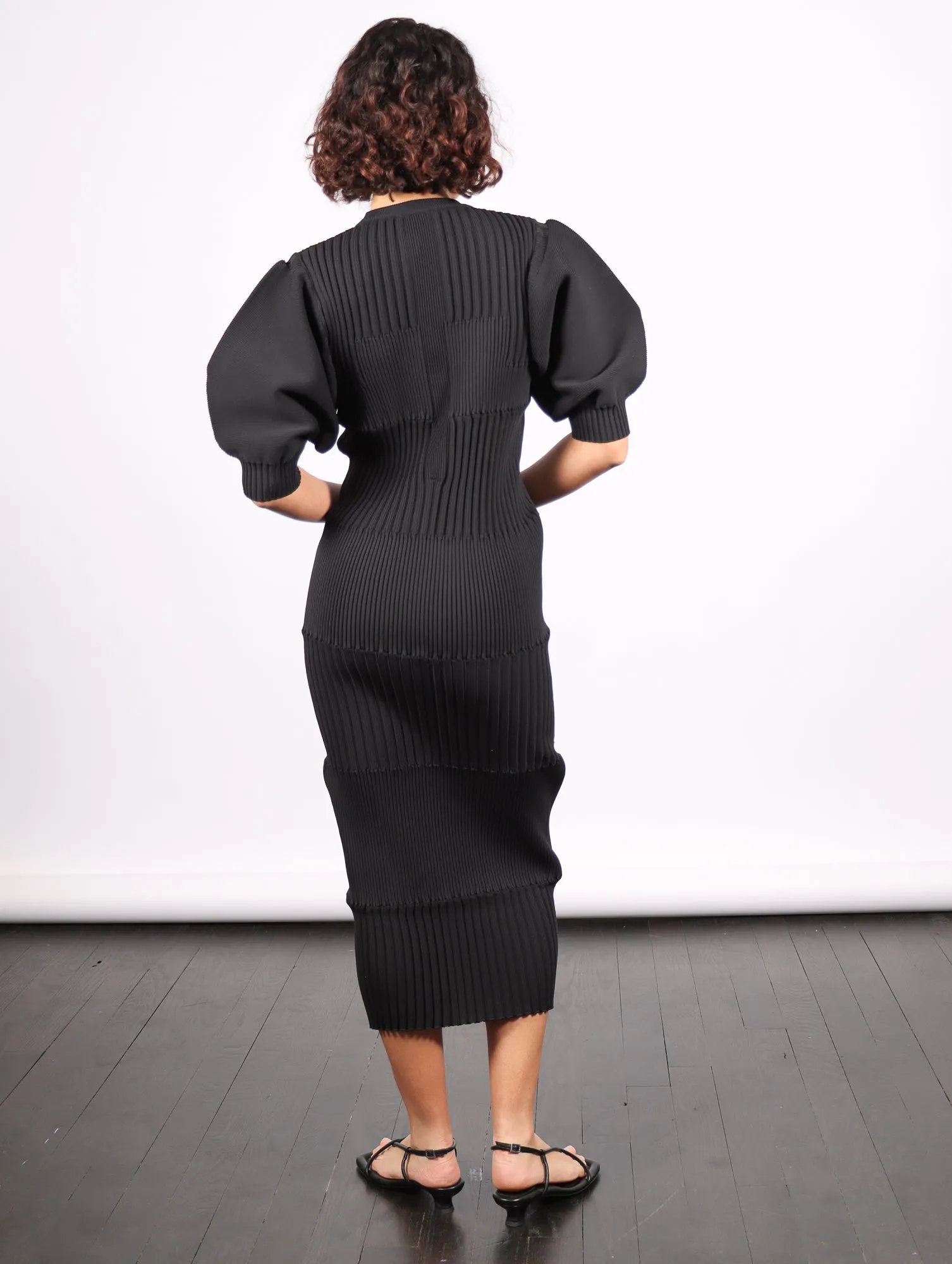 Fluted Short Puff Sleeve Dress in Black by CFCL