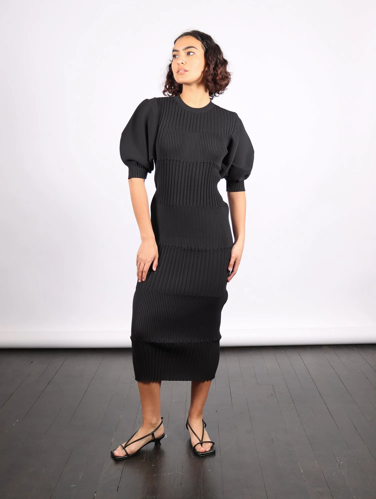 Fluted Short Puff Sleeve Dress in Black by CFCL